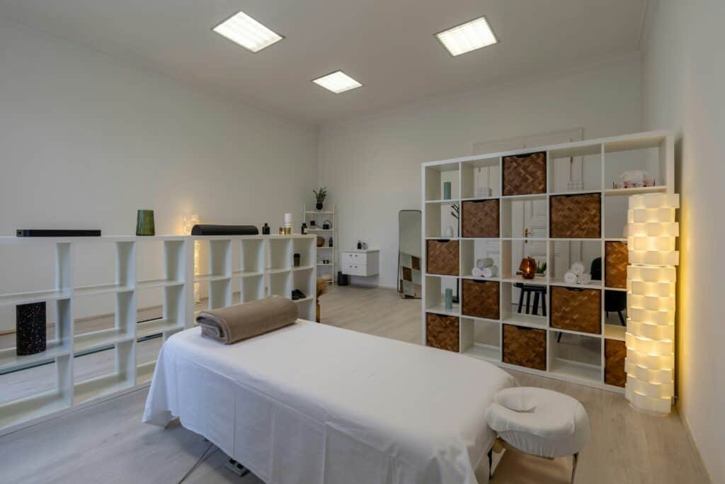 Clean, tidy massage therapy room ready for a spa session