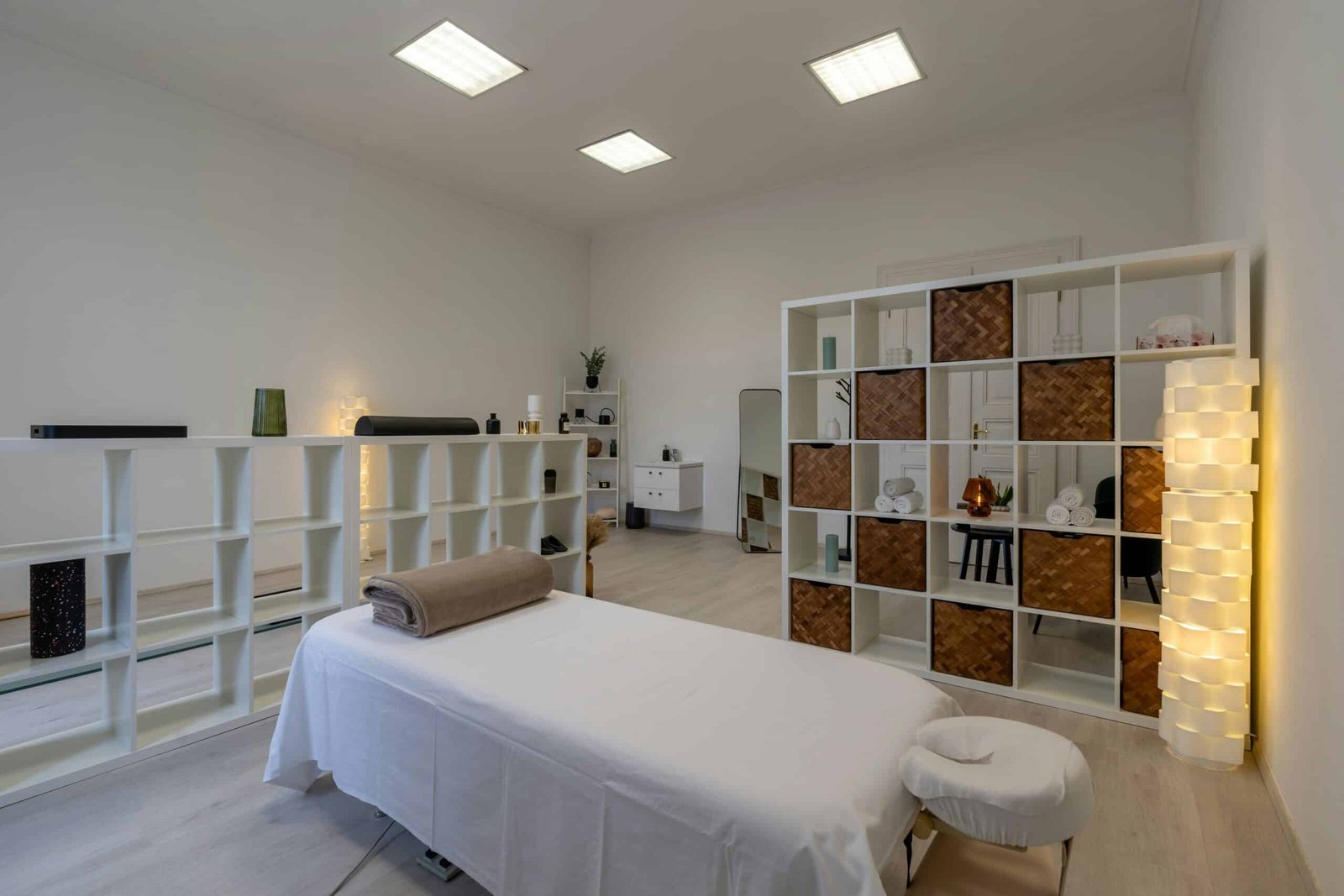 Clean, tidy massage room prepared for a calm spa session